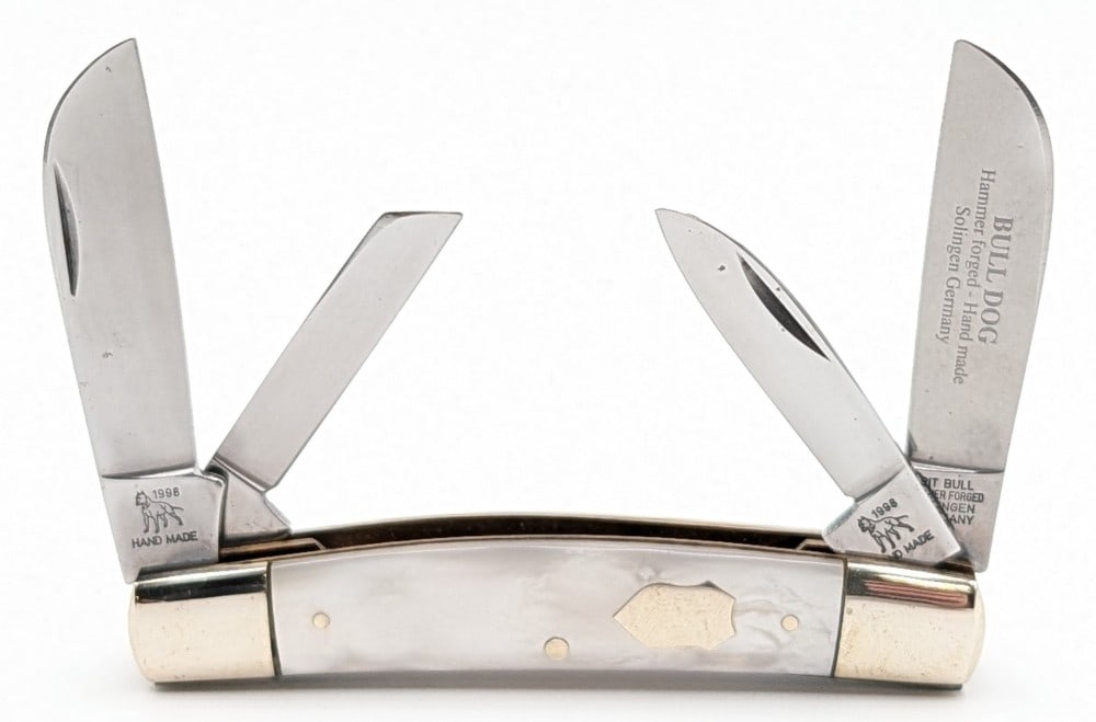 1998 Bulldog Brand Faux Pearl Congress Knife: Knife is in nice condition with some carbon spots on the blades, and light scuffs and dings on the bolsters from handling. Overall measures 3-5/8in when closed.