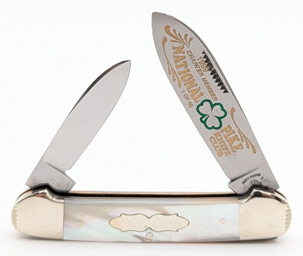 Ltd 1999 Fight'n Rooster Frank Buster Pike Knife Club Mother of Pearl Canoe Knife: Knife is 1 of 40, and is in very nice condition with light tarnishing from handling and age. Overall measures 3-5/8in when closed.