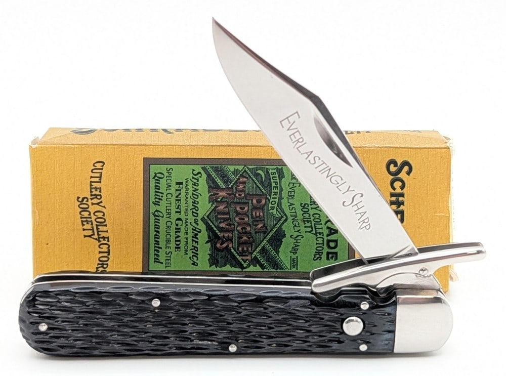 2008 Schrade Collectors Society Rough Black Swing Guard Folding Knife w/ Box: Knife is 1 of 600, and is in like new condition. Overall measures 5in when closed.