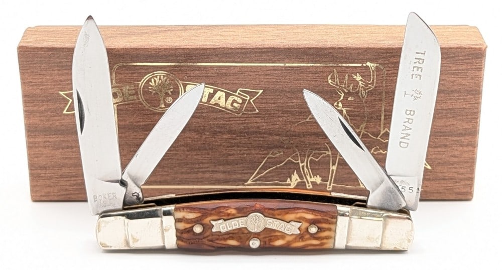 1976 Boker Tree Brand Olde Stag Delrin Congress Knife w/ Box: Knife is in good condition with some light carbon spots on the blades, and light scuffs and tarnishing on the bolsters from age. Overall measures 3-5/8in when closed.