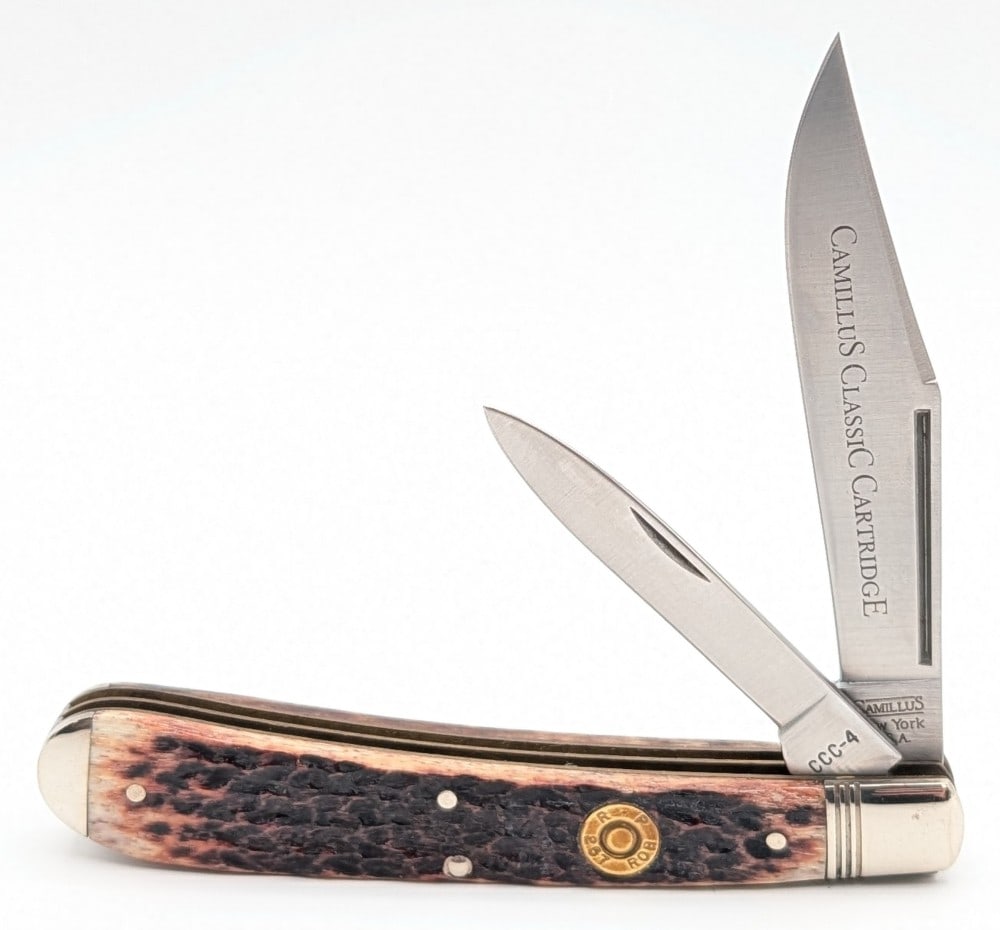 Camillus Classic Cartridge .257 Roberts Jigged Bone Banana Trapper CCC-4: Knife is in very nice condition with light tarnishing on the bolsters from handling. Overall measures 5-3/8in when closed.