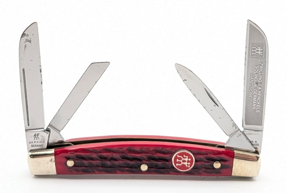 J.A. Henckles Herring Bone Jigged Red Bone Congress Knife: Knife is in nice condition with light scuffs and tarnishing on the bolsters from handling. Overall measures 3-5/8in when closed.