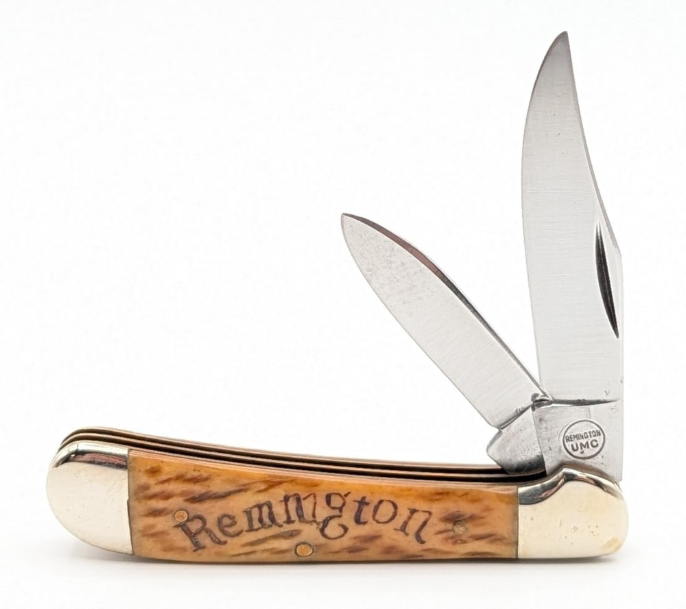 Remington Jigged Bone Copperhead Folding Knife: Knife is in nice condition with some light scuffs on the blades, and some scuffs and dings on the polished bolsters. Overall measures 3-3/8in when closed.