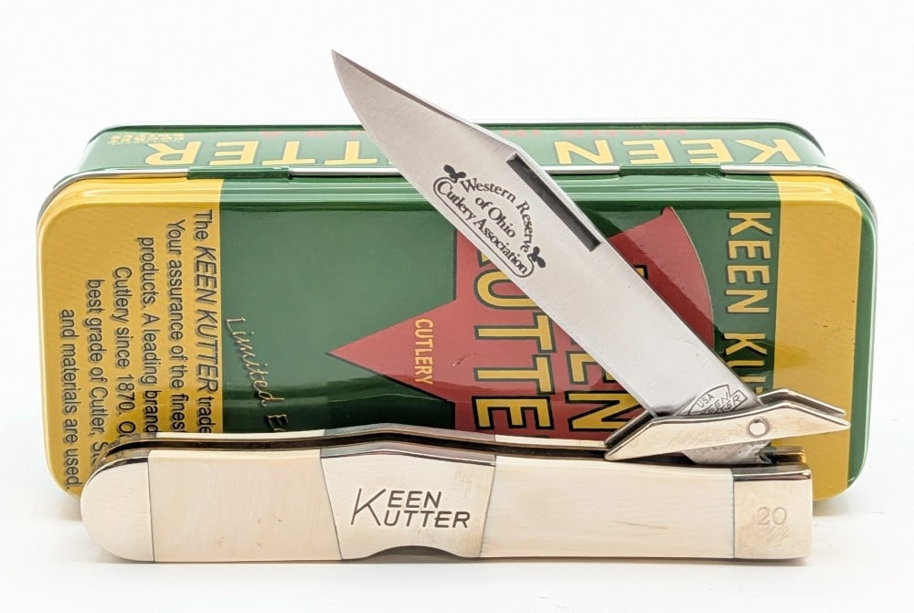 Ltd Keen Kutter WROCA Exotic Bone Swing Guard Lock Back w/ Tin: Knife is numbered 20. Knife is in very nice condition with light tarnishing on the bolsters, and natural cracks in the exotic bone. Overall measures 4-3/8in when closed.