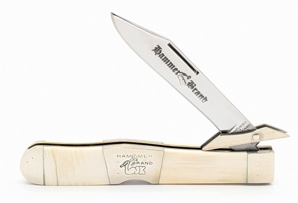Hammer Brand New York Knife Co. Exotic Bone Swing Guard Lockback: Knife is in very nice condition with light tarnishing on the bolsters from handling. Overall measures 4-3/8in when closed.
