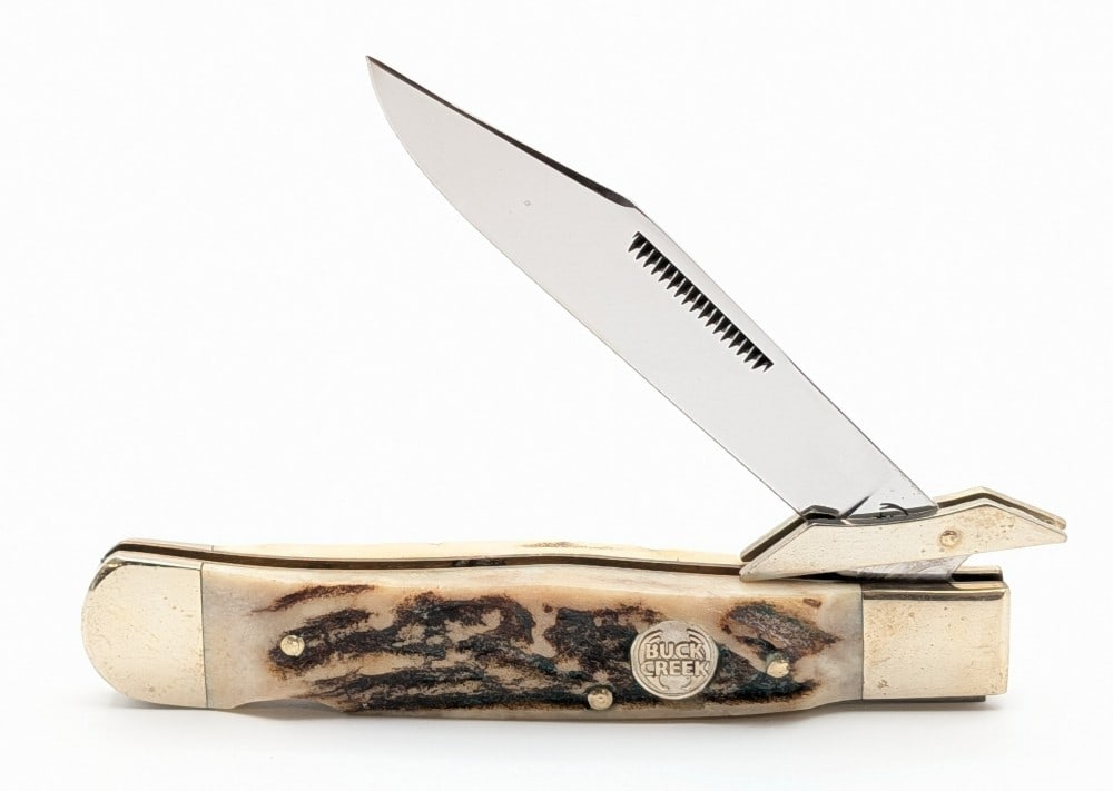 Buck Creek Stag Swing Guard Lockback Cheetah: Knife is in very nice condition with light tarnishing on the bolsters from handling. Overall measures 4-3/8in when closed.