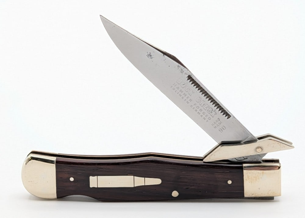 Buck Creek Smooth Wood Swing Guard Lock Back Cheetah: Knife is in nice condition with some carbon spotting on the blade, and tarnishing on the bolsters from age. Overall measures 4-1/4in when closed.