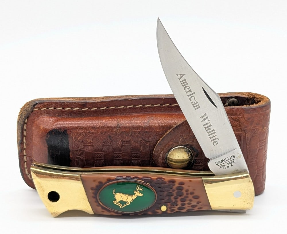 Camillus American Wildlife Jigged Delrin Lock Back Knife w/ Sheath: Knife is in good condition with some light scratches on the blade, and scuffs and dings on the bolsters. Overall measures 4-3/4in when closed.