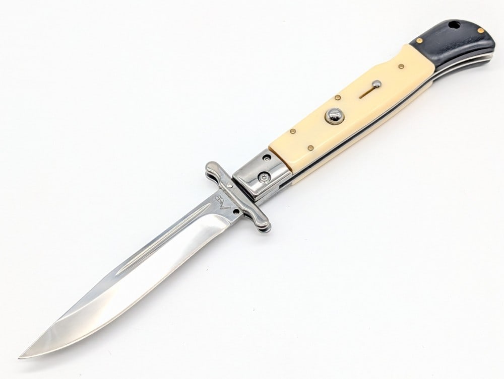 AKC 11in Synthetic White Swing Guard Switchblade Knife: Knife is in like new condition. Overall measures 6in when closed.