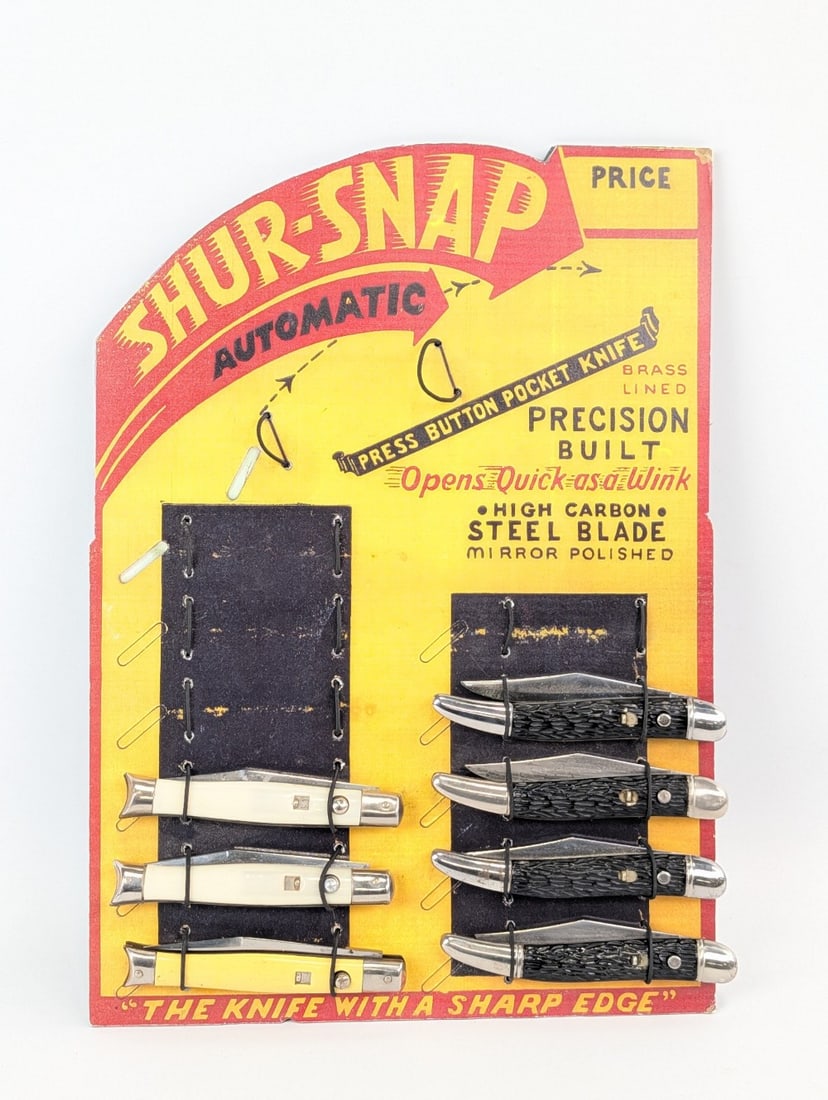 Repro Shur-Snap Switchblade Counter Top Store Display: Includes Shur-Snap and Hammer Brand toothpick and fishtail switchblades. Knives are in good condition with scuffs and tarnishing on the bolsters from handling and age. Display measures 9in wide x