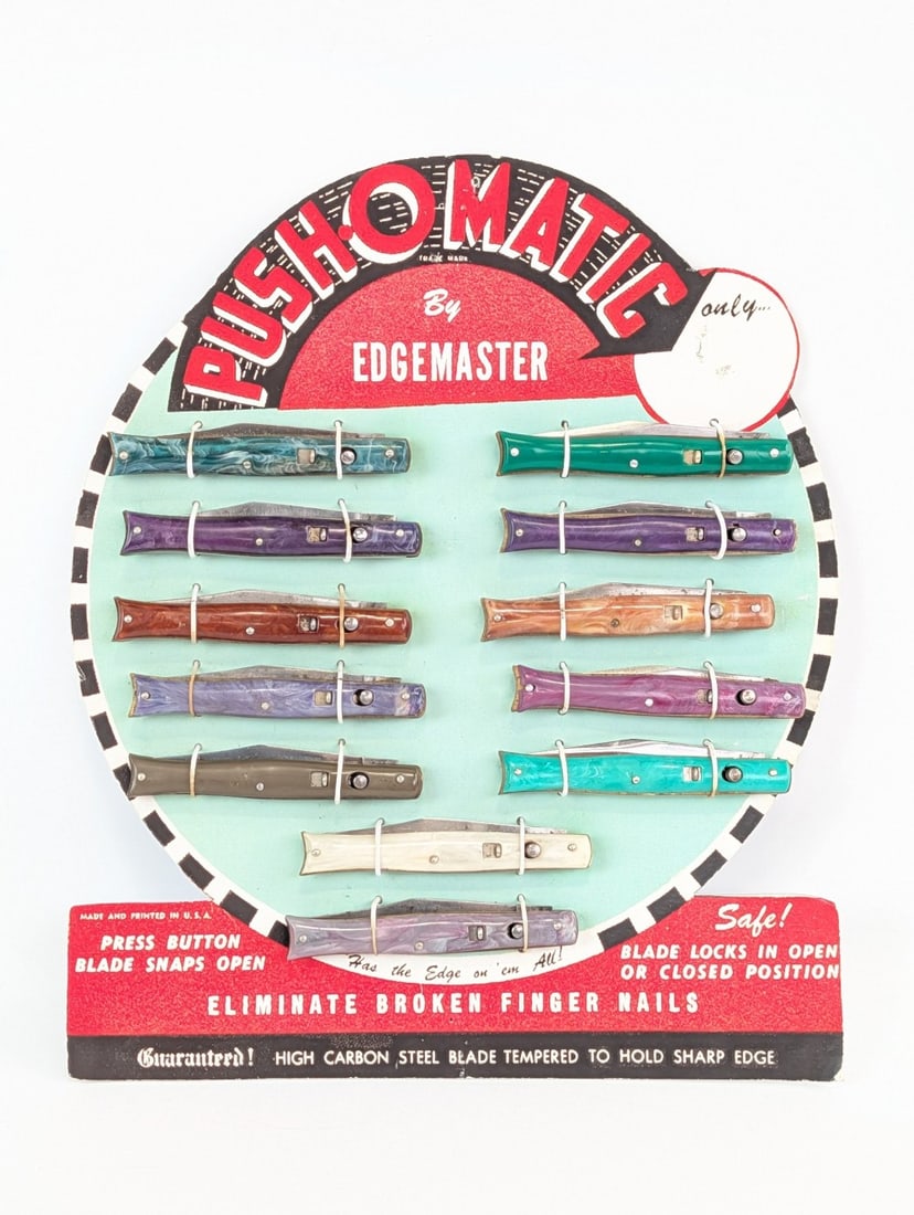 Repro Push-o-Matic Edgemaster Fishtail Switchblade Knife Store Display: Knives are in various conditions with different amounts of tarnishing and scuffs on the blades and handles from age. Display measures 10-1/2in wide x 12-1/2in tall.