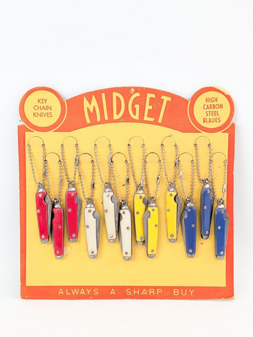 Midget Keychain Knife Counter Top Store Display: Knives are in nice condition with light tarnishing, and some light scuffs on the display. Overall measures 8in wide x 8in tall.