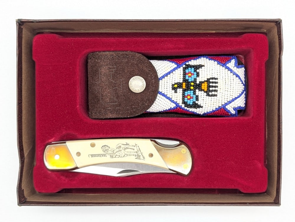 Schrade Cutlery Co. Scrimshaw Edition Thunderbird Lock Back Folding Knife w/ Sheath & Box: Comes in the box with the bead worked sheath. Knife is in very nice condition with tarnishing on the brass from age. Overall measures 5in when closed.
