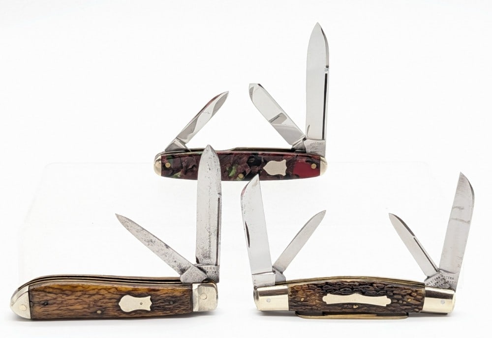 Western & Syracuse Knife Co. Folding Knives: Knives are in fair condition with scratches and material loss on the polished blades, and scuffs and dings on the bolsters from use and handling. Overall measures 3-1/2in when closed.
