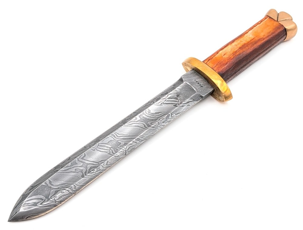 Custom Jesse Stag Double Edged Damascus Fighting Knife: Maker was a contestant on the show Forged in Fire. Features a thick double edged fullered damascus blade, a? brass double guard, an aged stag handle, and a decorated brass pommel. Sword is in very nic