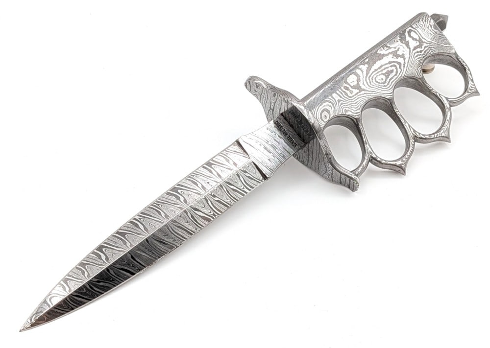 Charlton LTD Full Damascus Trench Fighting Knife: Features a full damascus blade, damascus handle / knuckle guard, and a damascus crusher pommel. A very unique looking knife quality made. Knife is in very nice condition with a few small tarnish spots