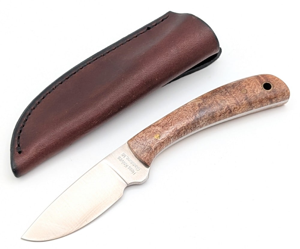 Hess Knives Burl Wood Drop Point Hunter w/ Sheath: Features a satin finish drop point blade, a full tang handle construction, and burl wood handle scales with a lanyard hole. Knife is in very nice condition with light scuffs from handling. Blade lengt