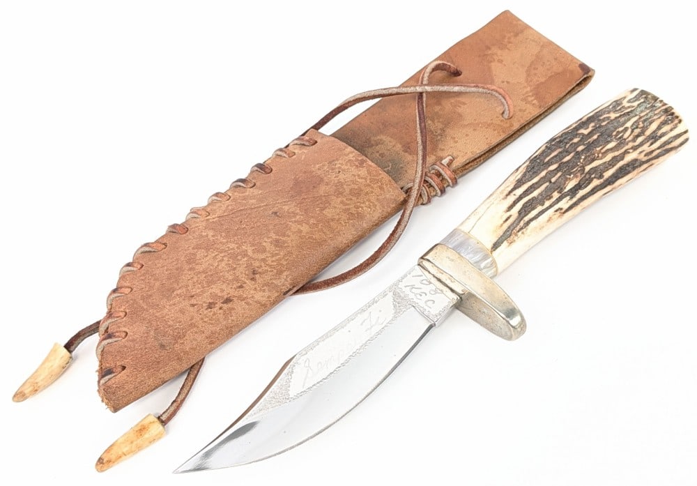 Drew Cook Custom Stag Clip Point Hunter w/ Sheath: Features a mirror polished clip point blade with hand engraving, and oblong nickel silver guard, and a stag handle with a resin spacer. Knife is in nice condition with light scuffs and tarnishing from