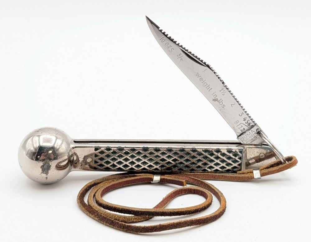 Puma Stainless Steel Knocker Fisherman's Knife: Knife is in good used condition with scratches on the blade, and dings and tarnishing on the handle from use and age. Overall measures 6in when closed.