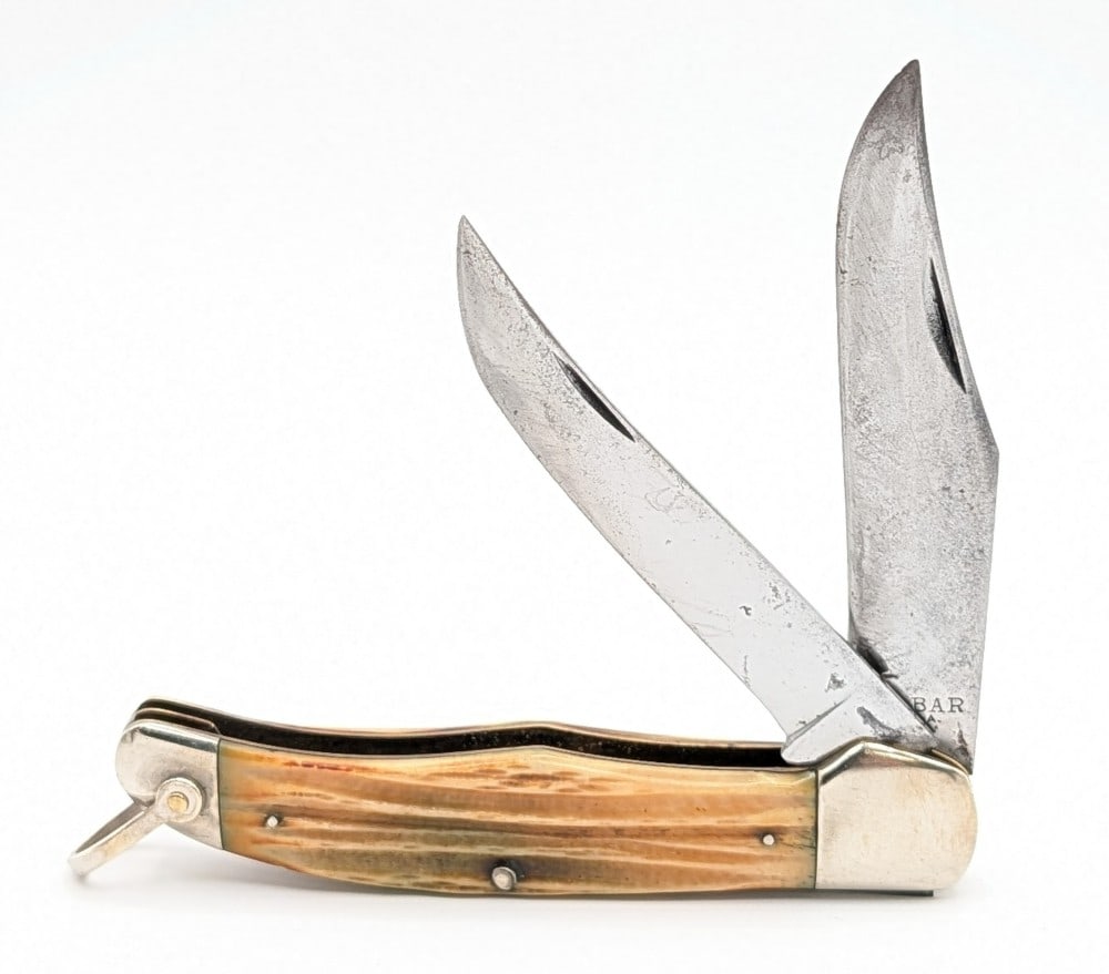 Ka-Bar Second Cut Bone Folding Hunter: Knife is in good aged condition with scratches and some material loss on the blades, scratches on the bolsters, and a pin crack on the back handle scale bottom pin. Overall measures 5-1/4in when close