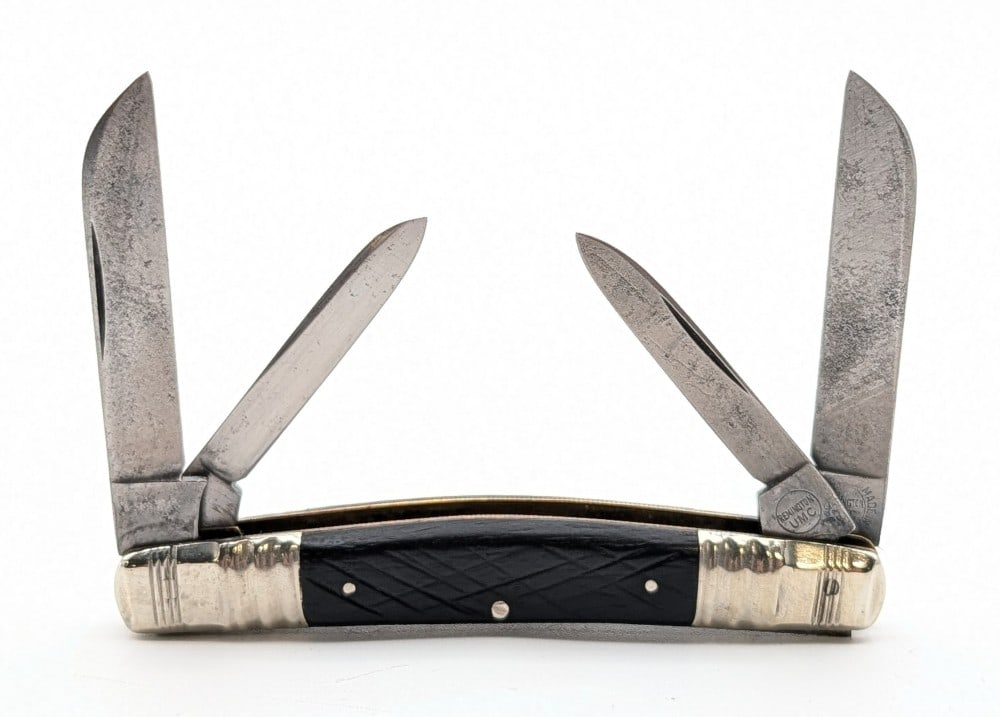 Remington Jigged Ebony Wood Congress Knife R6032: Knife is in good aged condition with scratches and pits on the blades, and scuffs and tarnishing on the bolsters from use and age. Overall measures 3-1/2in when closed.