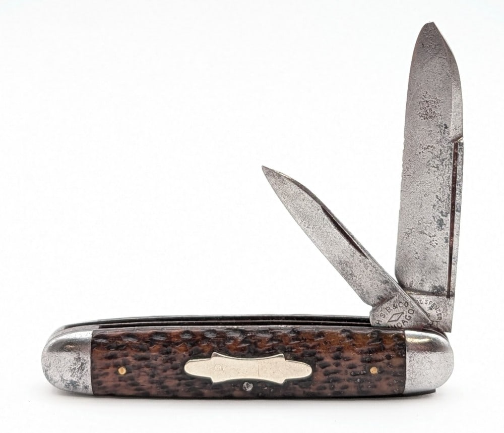 Hibbard Spencer & Bartlett Jigged Bone Long Pull Cigar Jack Knife: Knife is in fair aged condition with heavy scratches and pits on the blades, pits and tarnishing on the bolsters, and nice handle scales. Overall measures 3-1/2in when closed.