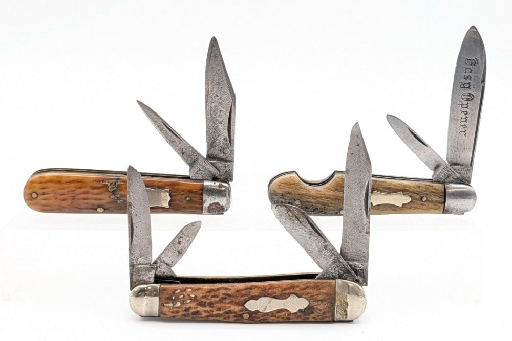 Majestic, Royal, & Hartford Cutlery Jigged Bone Folding Knives: Knives are in aged condition with heavy scratches and material loss on the blades, tarnishing and pits on the bolsters, and repairs and wear on the handle scales. Overall measures 3-3/4in when closed.