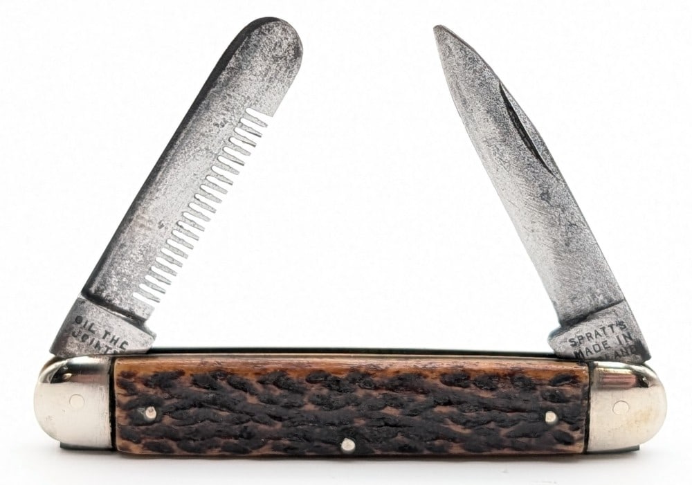 Spratt's Jigged Bone Cigar Comb Knife: Knife is in fair condition with scratches and material loss on the blade, scuffs and tarnishing on the bolsters, and nice handle scales. Overall measures 3-1/2in when closed.