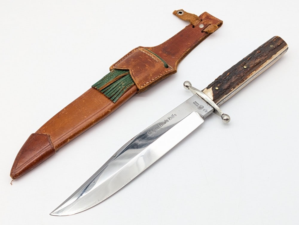 Doppelreh Stag Handle Original Bowie Knife w/ Sheath: Features a mirror polished clip point blade, a ball end double guard, and stag handle scales. Knife is in nice condition with some light scratches and carbon spots on the blade, and other light wear f