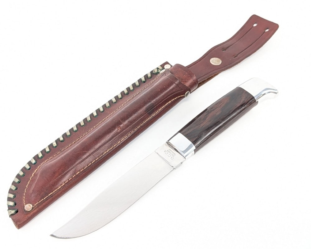 G.C. Co. Solingen Smooth Wood Hunter w/ Sheath & Marlin Spike: Features a mirror polished clip point blade, a polished reduced guard, smooth wood handle, and a polished beak pommel with a brass nut. Knife is in nice used condition with scratches on the blade, and