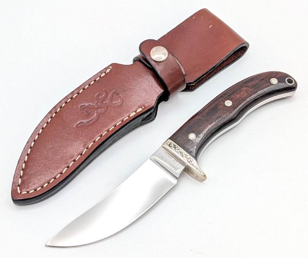 Ltd Browning Model 1886 Engraved Smooth Wood Hunter w/ Sheath: Knife is numbered 1 of 2500. Features a mirror finish blade, an engraved nickel silver single guard, full tang handle, and smooth wood handle scales with a lanyard hole. Knife is in very nice conditio