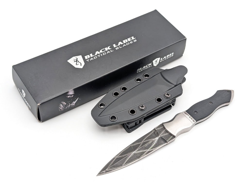NIB Buck Black Label Damascus Boot Dagger w/ Sheath: Features a weave pattern damascus blade, steel bolster, and black G-10 handle scales. Knife is in new condition. Blade length measures 4in and overall 8-1/2in.
