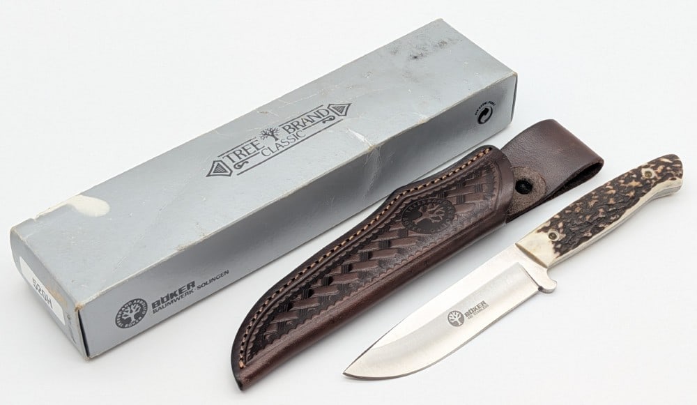 Boker Argentina Stag Drop Point Hunter 520H w/ Sheath & Box: Knife is in like new condition. Blade length measures 4in and overall 8in.