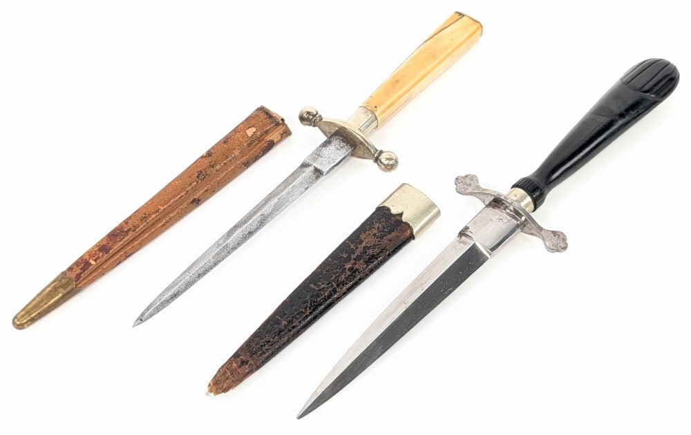 (2) Unmarked Antique Boot Daggers: Knives are in different aged condition with different amounts of scratches and pits on the blades, and other scuffs and wear from age. Largest blade length measures 4-3/4in and overall 8-1/2in.