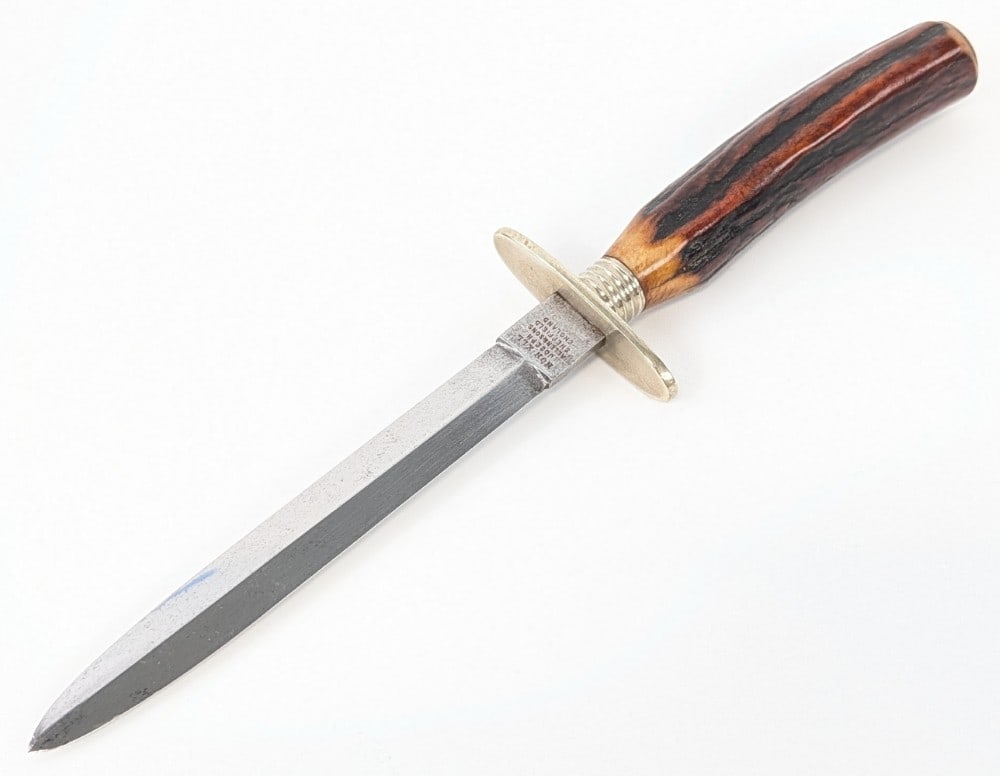 Joseph Allen & Sons Non-XXL Stag Dagger: Features a double edge blade, a nickel silver double guard, a nickel silver collar, a stag handle, and a nickel silver butt cap. Knife is in good aged condition with scratches and tarnishing on the bl