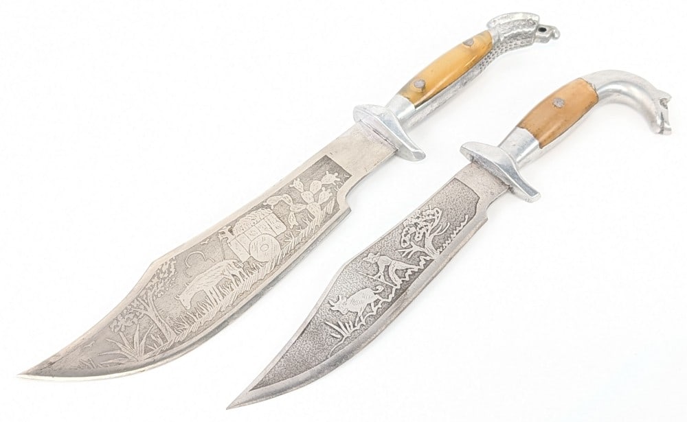 (2) Mexican Eagle Head Clip Point Fighting Knives: Knives are in good condition with some scuffs and tarnishing on the blades, and scratches on the cast metal handles. Largest blade length measures 6in and overall 9-1/2in.