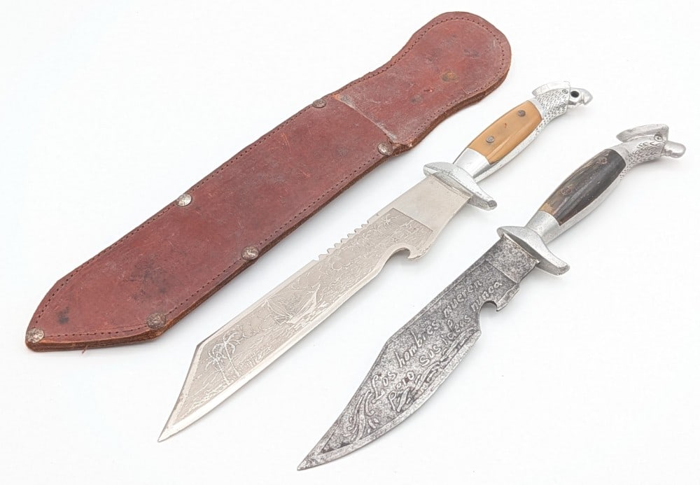 (2) Mexican Eagles Head Fighting Knives: Knives feature etchings on the blades, aluminum handles with eagle head pommels, and horn handle scales. Knives are in good aged condition with light scratches and tarnishing on the blades, and other 