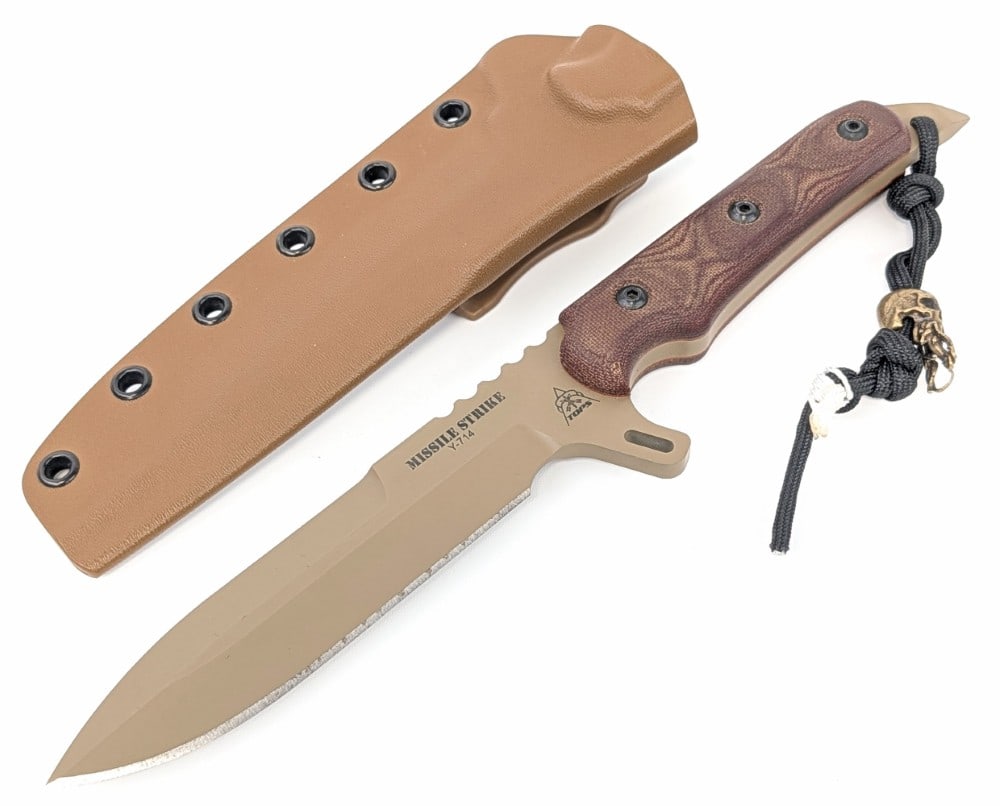 TOPS Missile Strike Spear Point Fighting Knife w/ Sheath: Features a green finish spear point blade with thumb notches, a large finger guard, a full tang handle construction, micarta handle scales, and a skull breaker pommel with a Cthulhu lanyard. Knife is 