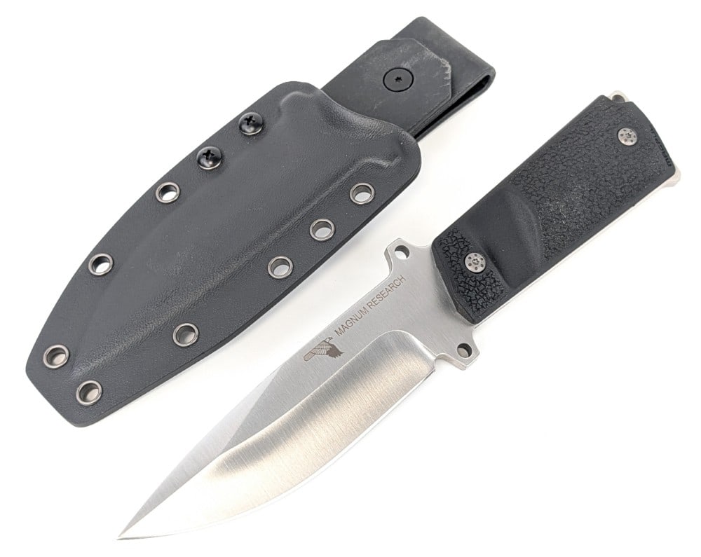 Magnum Research 1911 Grip Fixed Blade Knife w/ Sheath: Features a satin finish drop point blade, an integral guard, a full tang handle, and 1911 pistol grip handle scales. Knife is in like new condition. Blade length measures 4-1/2in and overall 9-1/2in.
