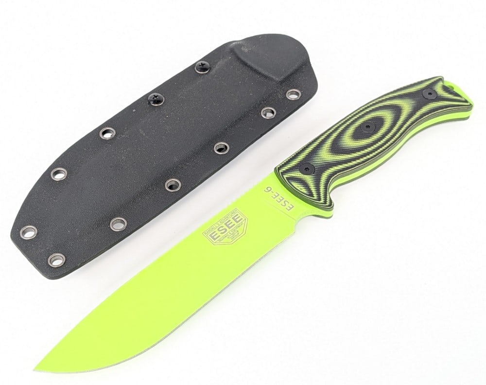 ESEE Knives ESEE-6 Rowen Green Drop Point Hunter w/ Sheath: Features a green finish drop point blade with thumb notches, a full tang handle, and black and green laminated micarta handle scales. Knife is in like new condition. Blade length measures 6-1/2in and 