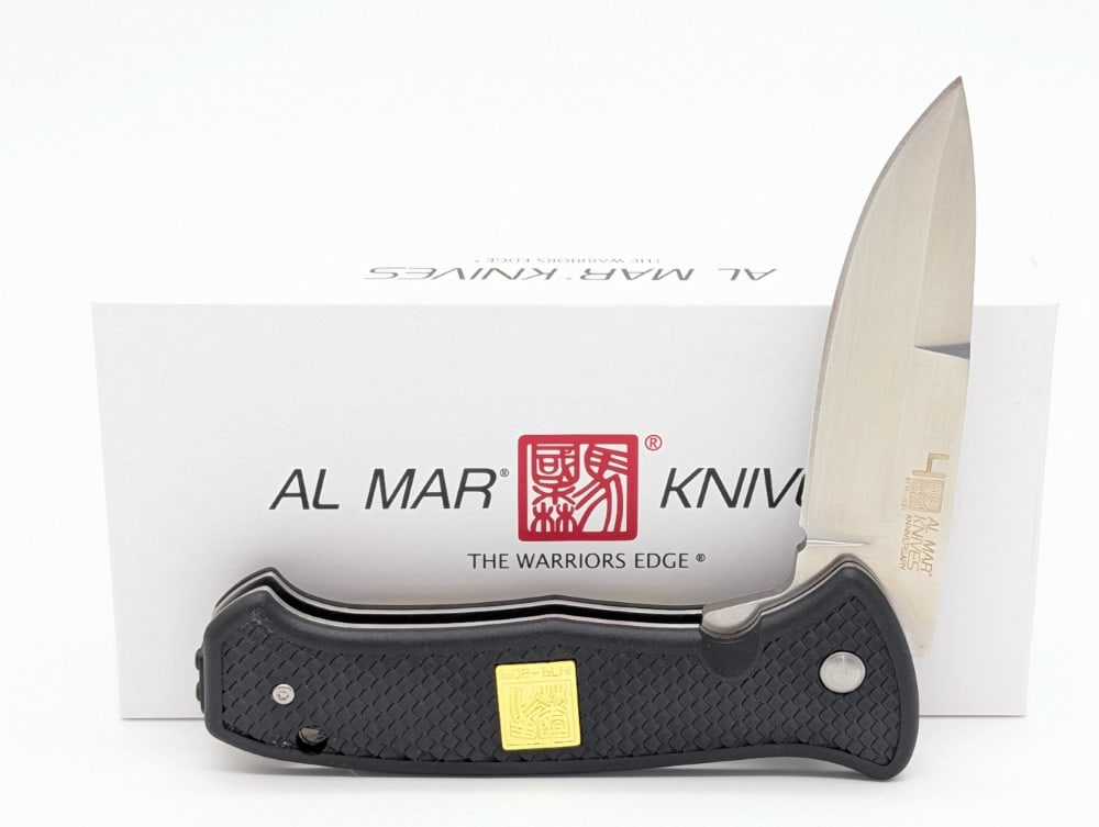 NIB Al Mar SERE 40th Anniversary Black Flipper Folding Knife: Knife is in new condition. Overall measures 4-7/8in when closed.