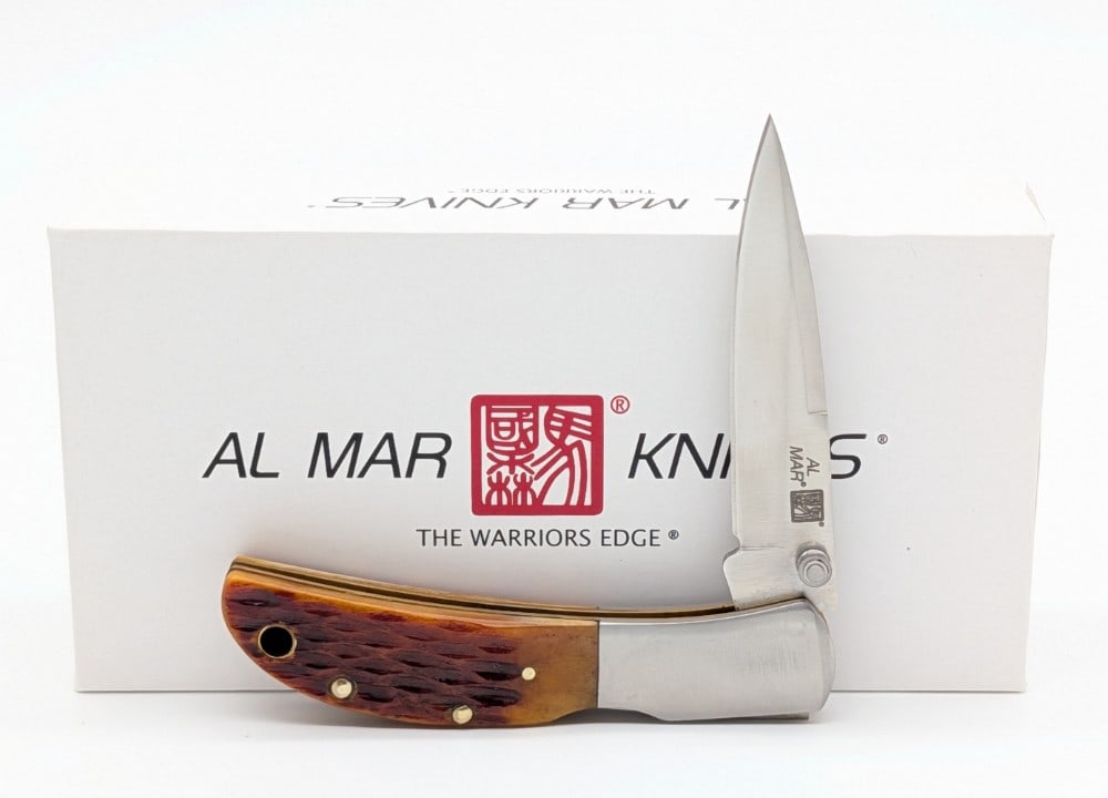 NIB Al Mar Classic Collection Honey Jigged Bone Hawk: Knife is in new condition. Overall measures 3-1/4in when closed.