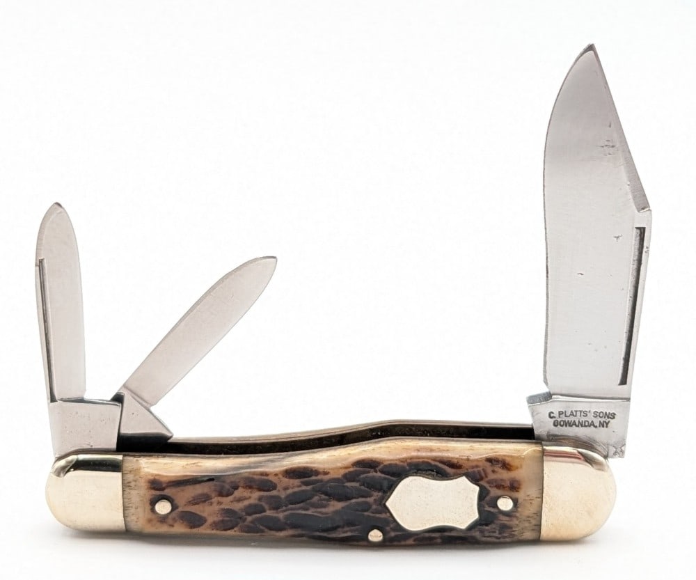 C. Platts' Sons Jigged Bone Long Pull Whittler: Knife is in nice condition with some light scuffs and material loss on the polished blades, scuffs on the polished bolsters, and nice handle scales. Overall measures 3-1/2in when closed.
