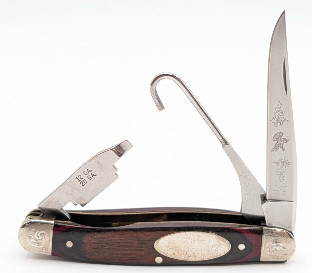 Ltd Remington Smooth Wood Scroll Bolster Bird Hunter Knife: Knife is 1 of 1000, and is in nice condition with tarnishing on the shield and other light scuffs from handling. Overall measures 3-7/8in when closed.