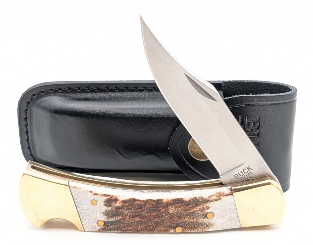 Buck 110 Stag File Worked Lock Back Folding Knife w/ Sheath: Knife features file work along the spring, and is in like new condition with tarnishing on the brass from age. Overall measures 4-7/8in when closed.