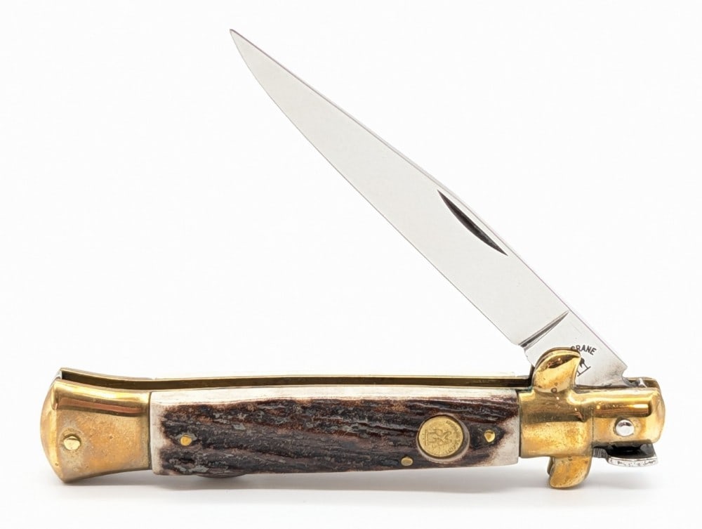 Kissing Crane Stag Stiletto Lock Back Knife: Knife is in very nice condition with tarnishing on the brass from age. Overall measures 4-3/8in when closed.