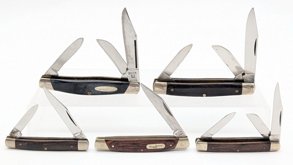 Browning & Buck Smooth Wood & Delrin Folding Knives: Knives are in various condition with different amounts of scuffs and wear from use and handling. Largest overall measures 3-1/4in when closed.
