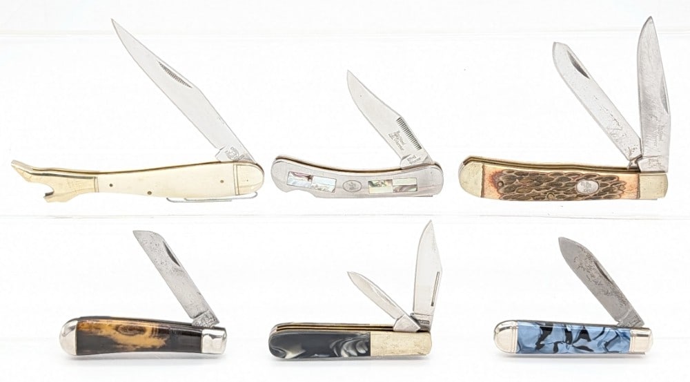 (6) Various Brand Folding Knives: Brands include Rough Rider, Steel Warrior, Moonsai, and Richards. Knives are in various condition with different amounts of scuffs and wear from use and handling. Largest overall measures 5in when clo