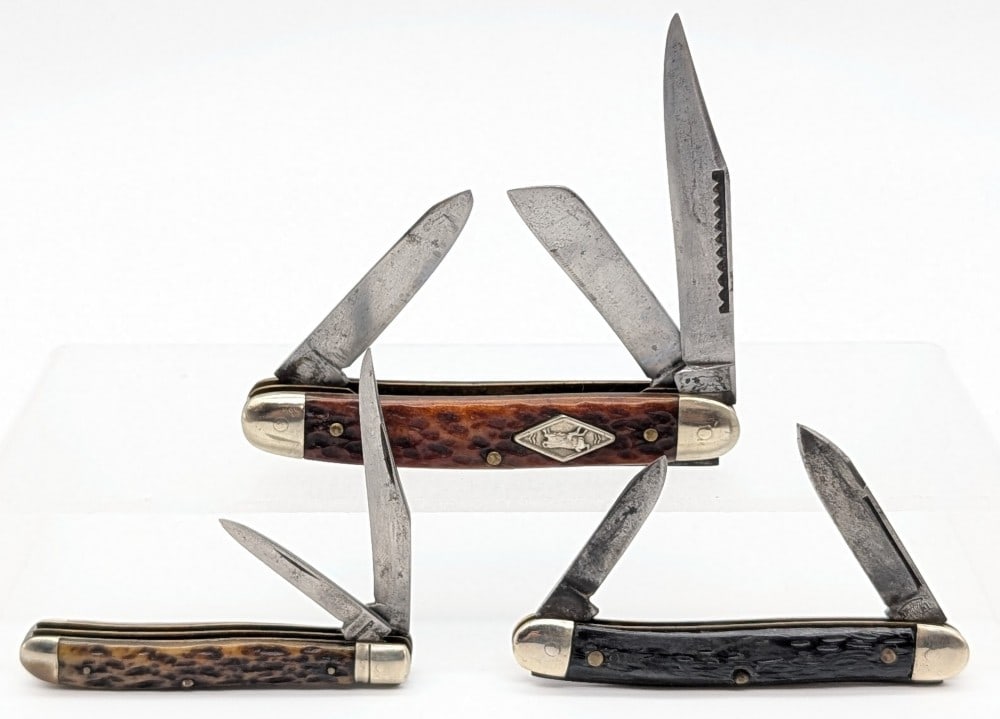 Winchester, Keen Kutter, & Ox Brand Folding Knives: Knives are in aged conditions with scratches and tarnishing on the blades, scratches and dings on the bolsters, and general wear on the handle scales from use and age. Largest overall measures