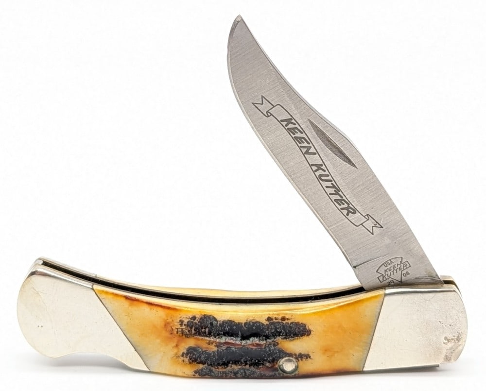Keen Kutter Stag Lockback Folding Knife: Knife is in good condition with scratches and tarnishing on the bolsters from handling and age. Overall measures 3-3/4in when closed.